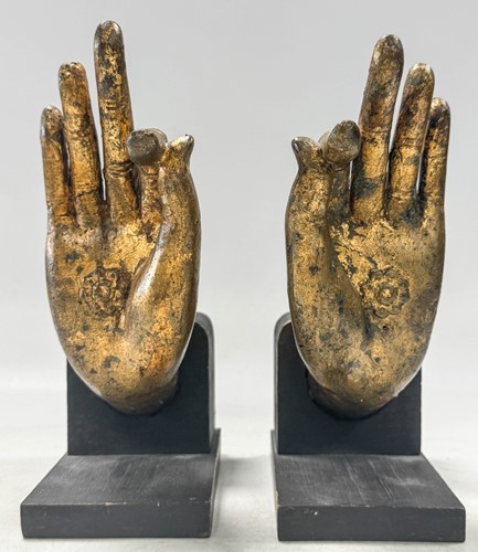 Lot 97 - A pair of Tibetan gilt bronze Buddha hands, 19th century