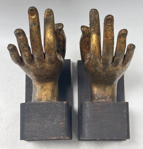 Lot 97 - A pair of Tibetan gilt bronze Buddha hands, 19th century