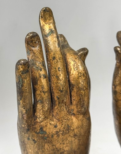 Lot 97 - A pair of Tibetan gilt bronze Buddha hands, 19th century