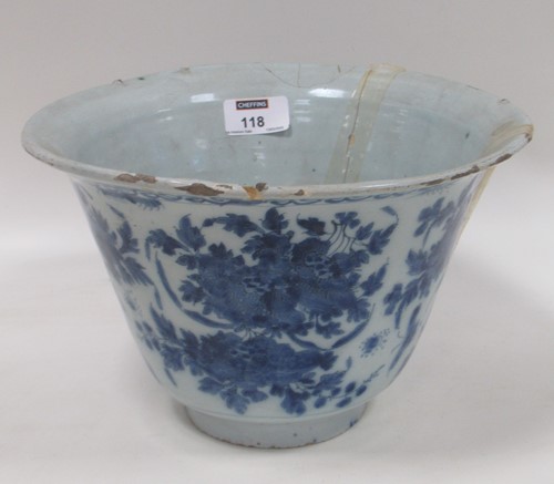 Lot 118 - A Delft bowl decorated with blue and white...