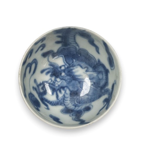 Lot 18 - Two Chinese blue and white porcelain small dragon bowls, Qing Dynasty circa 1720