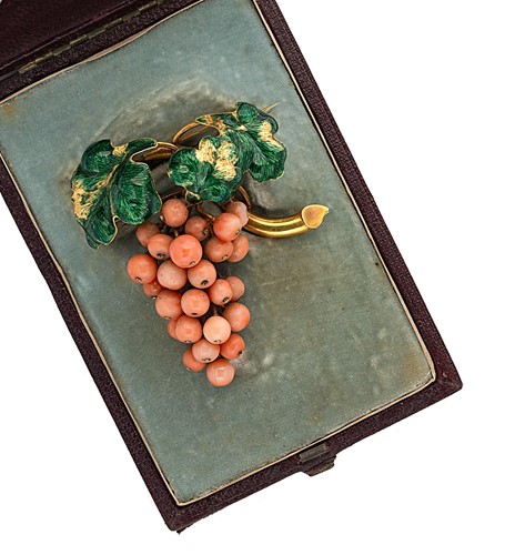 Lot 84 - A coral and enamel brooch