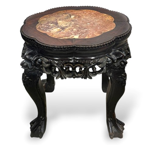 Lot 82 - An Oriental red marble inset hardwood jardiniere stand, circa 1900
