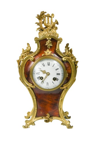 Lot 485 - A French Rococo style ormolu mounted tortoiseshell mantel clock, late 19th century