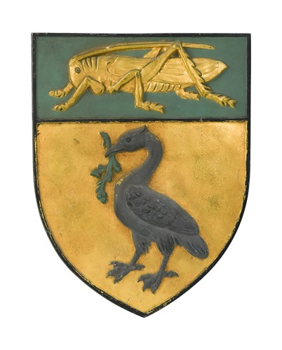 Lot 620 - A cast metal shield shape plaque, 20th century
