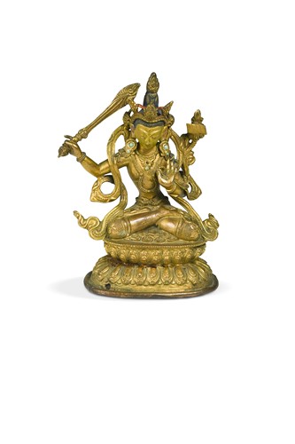 Lot 105 - A Tibetan gilt copper figure of the Bodhisattva Manjusri, 18th century