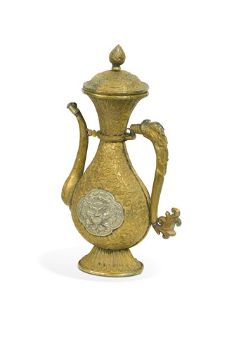 Lot 100 - A Tibetan gilt brass and repousse wine ewer, 18th/19th century