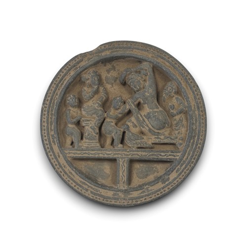 Lot 111 - A Gandhara grey schist carved Buddhist roundel, in the style of the 3rd/4th century AD