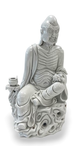 Lot 48 - A Chinese Blanc de chine (Dehua) seated arhat, 20th century