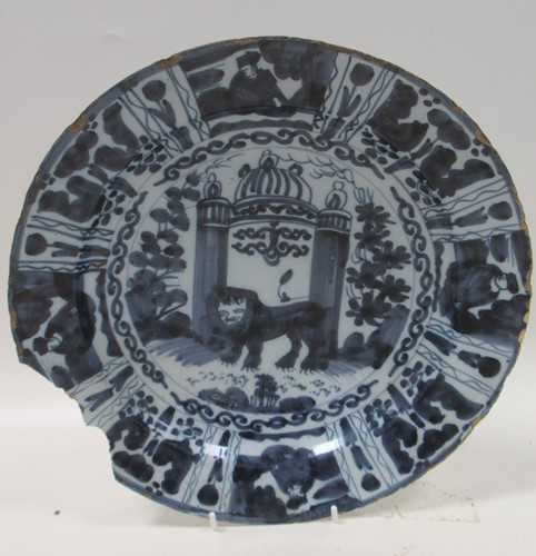Lot 92 - A Delft tinglaze dish in Kraak style painted...