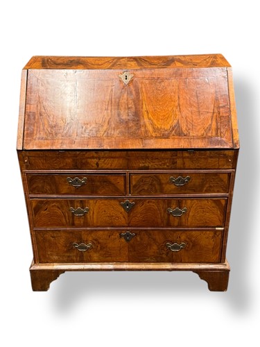 Lot 532 - A walnut bureau, early 18th century, the...