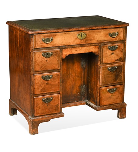 Lot 508 - A walnut kneehole desk, 18th century