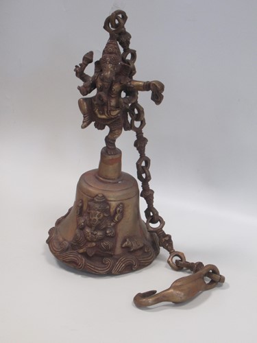 Lot 149 - An Indian bronze bell mounted with a figure of...