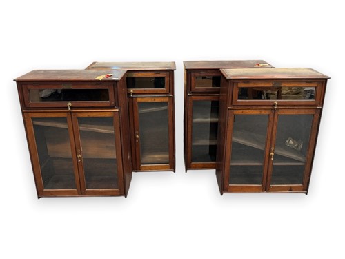 Lot 648 - A set of four glazed mahogany bookcases, each...
