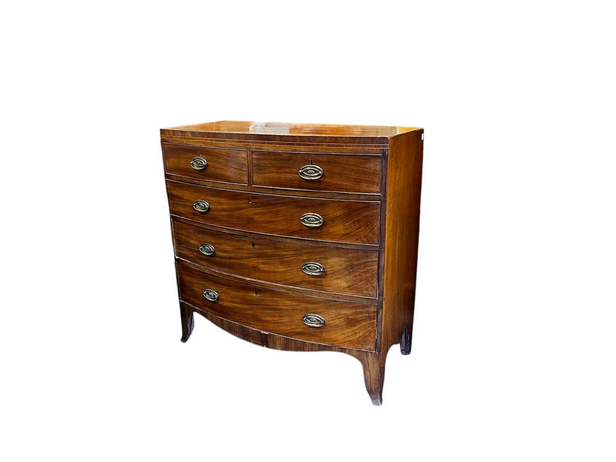 Lot 669 - A Regency mahogany bow front chest of drawers,...