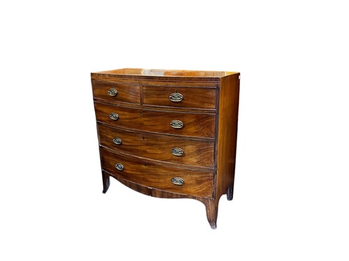 Lot 669 - A Regency mahogany bow front chest of drawers,...