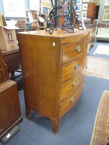Lot 669 - A Regency mahogany bow front chest of drawers,...
