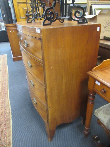 Lot 669 - A Regency mahogany bow front chest of drawers,...