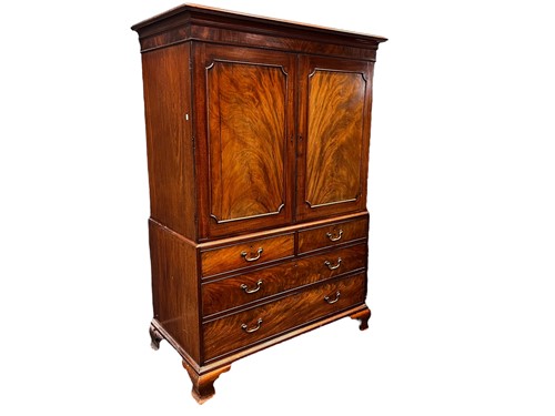 Lot 670 - A George III mahogany linen press, on ogee...