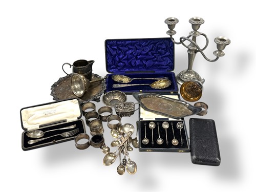 Lot 248 - A collection of silverware including napkin...