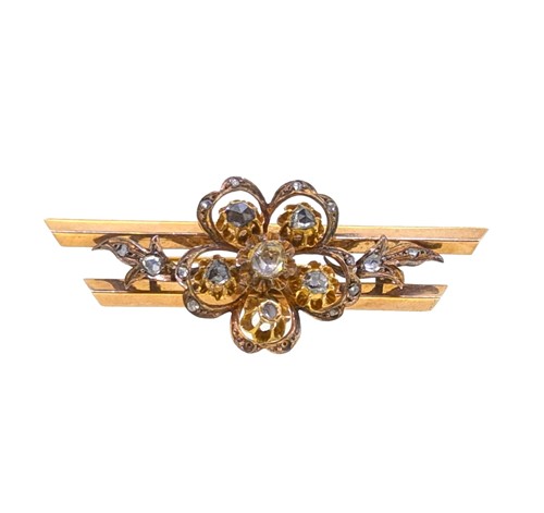 Lot 54 - A diamond set floral brooch