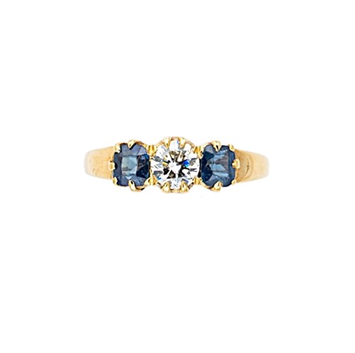 Lot 118 - A three stone sapphire and diamond ring