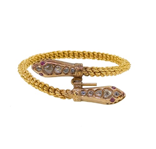 Lot 130 - A diamond set serpent bangle