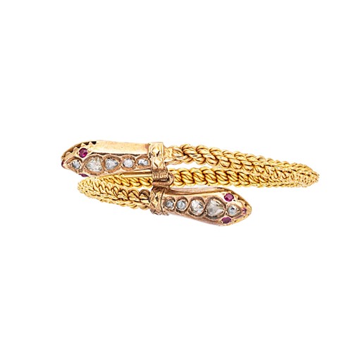 Lot 130 - A diamond set serpent bangle