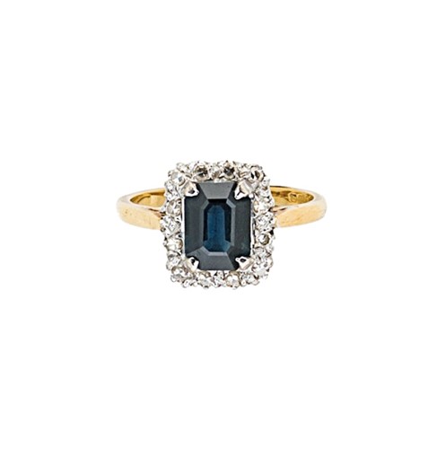 Lot 121 - A late 20th century 18ct gold sapphire and diamond cluster ring