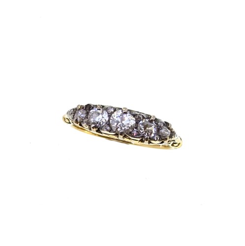 Lot 64 - A diamond set carved half hoop style ring