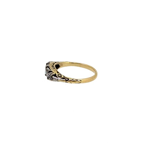 Lot 64 - A diamond set carved half hoop style ring