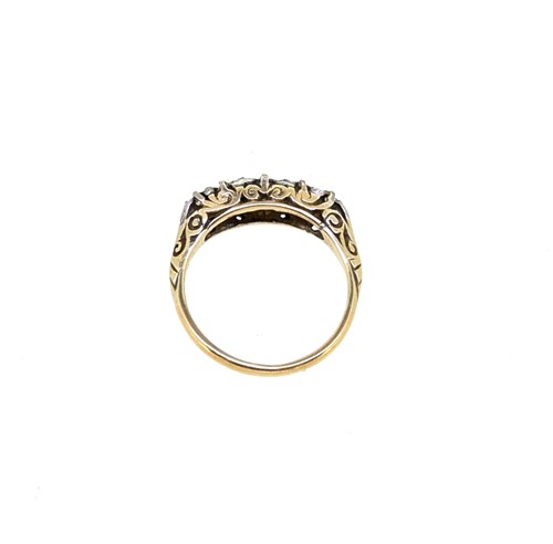 Lot 64 - A diamond set carved half hoop style ring