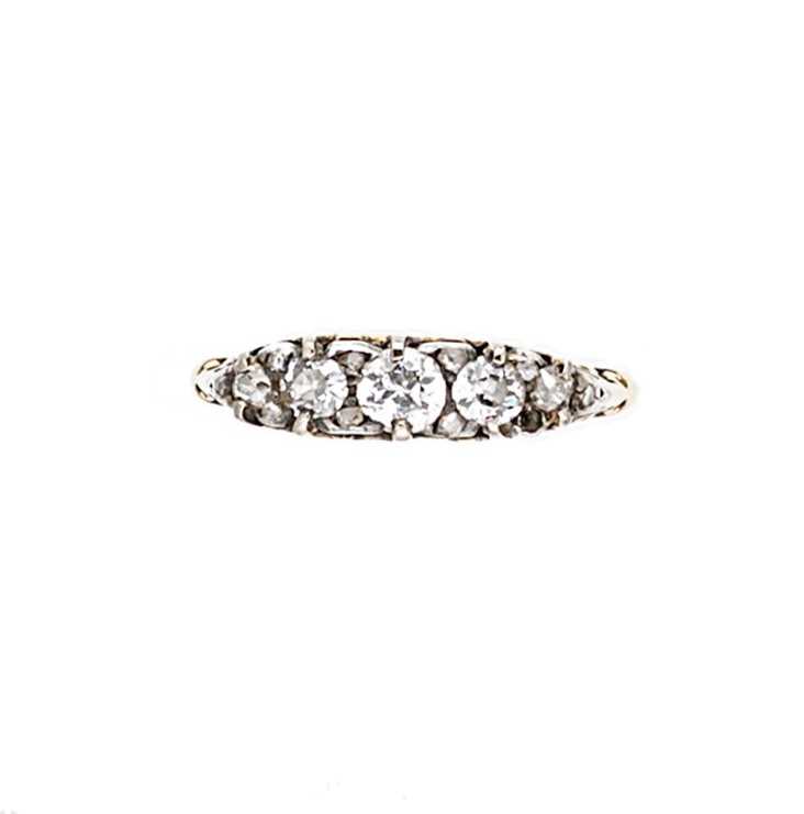 Lot 64 - A diamond set carved half hoop style ring