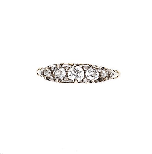 Lot 64 - A diamond set carved half hoop style ring