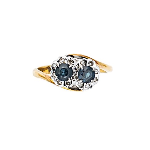 Lot 126 - An 18ct gold sapphire and diamond crossover style ring
