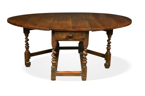 Lot 408 - A large walnut ten seat farmhouse gateleg dining table, early 18th century