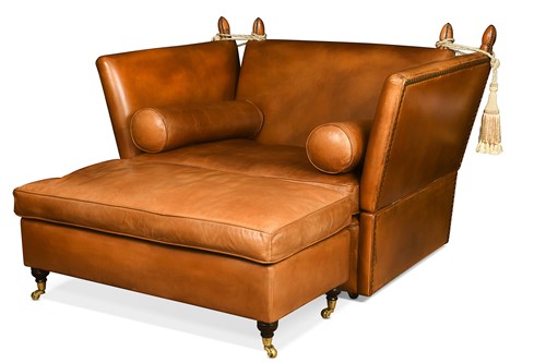 Lot 650 - A two-seater Knole type leather sofa and footstool, modern