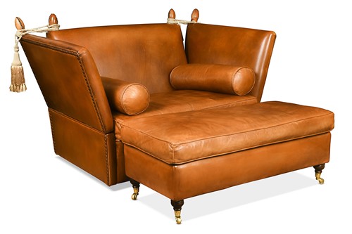 Lot 651 - A two-seater Knole type leather sofa and footstool, modern