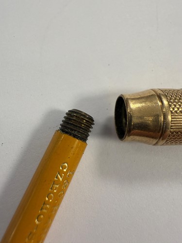 Lot 325 - A 9ct gold gravity fed propelling pencil, mark of Sampson Mordan, along with another