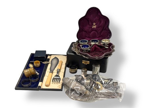 Lot 245 - A collection of silverware including napkin...