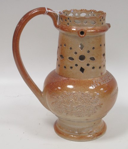 Lot 31 - A Victorian saltglazed puzzle jug, with...