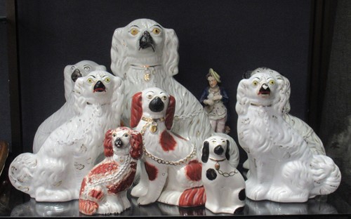 Lot 73 - A collection of Staffordshire figures to...