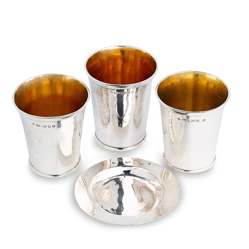 Lot 576 - A pair of Elizabeth II silver beakers, along with another example and a small dish