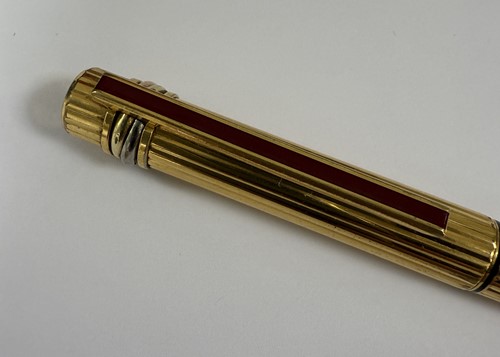 Lot 301 - Cartier - A 'Les Must De Cartier Trinity' fountain pen, together with a Tiffany letter opener