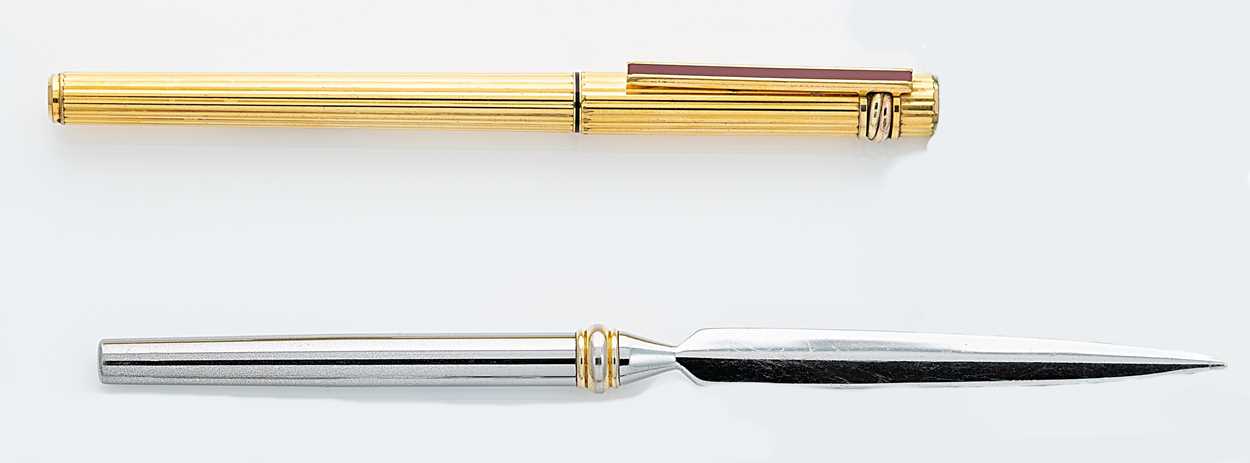 Lot 301 - Cartier - A 'Les Must De Cartier Trinity' fountain pen, together with a Tiffany letter opener