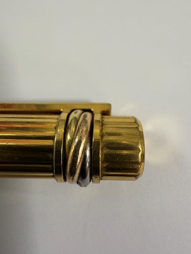 Lot 301 - Cartier - A 'Les Must De Cartier Trinity' fountain pen, together with a Tiffany letter opener