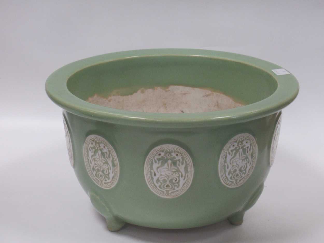 Lot 11 - An Oriental 'celadon' type glazed jardiniere...