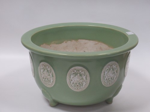 Lot 11 - An Oriental 'celadon' type glazed jardiniere...