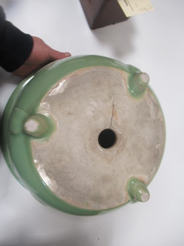 Lot 11 - An Oriental 'celadon' type glazed jardiniere...