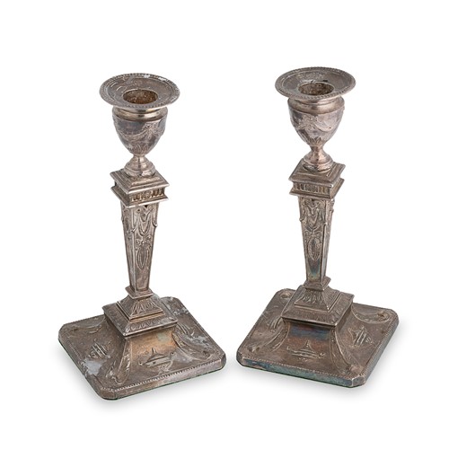 Lot 519 - A pair of George V silver library candlesticks